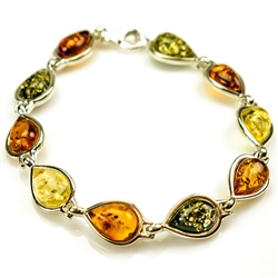 10 tear drop shaped amber beads each set in a sterling silver frame. 7" - 18cm long.