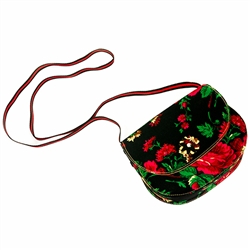 A large attractive shoulder bag made of leather and fabric.  24" long shoulder strap.