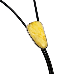 Beautiful black bolo tie with a large centerpiece of custard Baltic amber set in a sterling silver casing. Silver tipped ends.