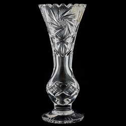 This is genuine Polish hand-cut leaded crystal decanter with matching crystal stopper.  Beautiful starburst cut is a classical pattern found in traditional Polish crystal.