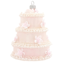 Serve up a delicious addition to any newlywed's tree with this wedding cake ornament! Crafted of glass in Poland, this beautiful cake is accentuated with beads and iridescent glitter. Commemorate that special day with our wedding cake ornament!
