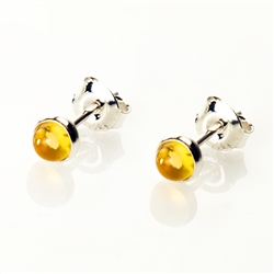 Baltic Amber stud earrings with sterling silver detail. Size is approx 5mm diameter.