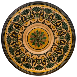 This Polish plate is made from beech wood in the mountain region of southern Poland called Podhale. The plates are cut and shaped on a lathe by hand. The floral designs are burned into the wood then painted after staining