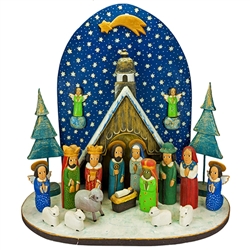 The Holy Family and in particular the Nativity is a popular theme in Polish folk art.  Composed of natural and hand painted wooden pieces. Easy assembly of manger, fence and tree which are pegged, no tools required.  Some base curvature is to be expected.