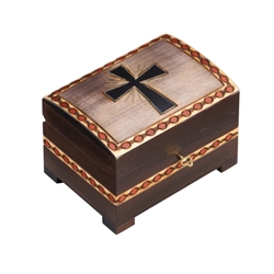The lid of this chest box features a hand carved cross. The edges of the lid and the sides of the box have additional carved details. A lock and key secure the lid. Handmade in the Tatra Mountain region of Poland.Handmade in Poland's Tatra Mountain region