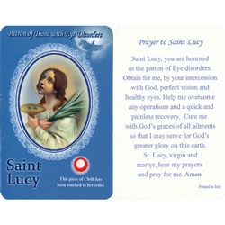 Healing Saint Lucy is the Patron of those with Eye Disorders. This unique prayer card contains a third class relics on the front with the prayer on the back. The piece of cloth has been touched to the relics.