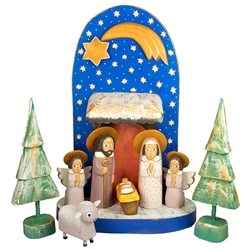 The Holy Family and in particular the Nativity is a popular theme in Polish folk art. Composed of natural and hand painted wooden pieces. Tallest figure is approx 6" tall. This is the work of folk artist Jerzy Zrbozek.
