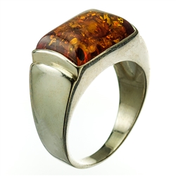 A perfectly cut rectangular piece of cognac colored amber set in sterling silver.  Size approx .75" x .5".