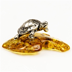 Our small sterling silver turtle has just landed on an natural amber ledge. Hand crafted.  Size approx 1.25" x 1.25" x .6"