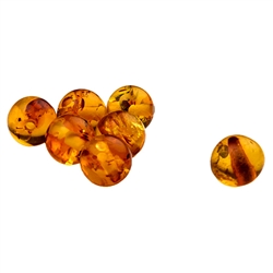 Jewelry makers will enjoy these genuine Baltic amber beads. Hole through each bead. Approx 6mm diameter.