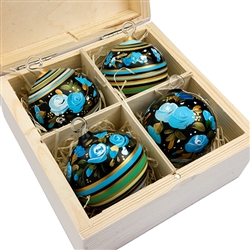 Hand painted glass ornaments in a deluxe painted wooden box. Magnetized lid. Hand made so no two ornaments or boxes are exactly the same. Ornaments are approx 2.25" in diameter.