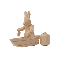 Most of the Russian action toys feature bears in action.  Here's an Old World wooden toy featuring Brer Rabbit.  As the pendulum below this Russian action toy swings, the carved rabbit paddles in the most delightful fashion.