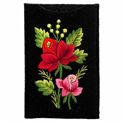 Soft black felt sewn case with Lowicz style embroidered flowers on one side.