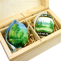 Beautifully hand painted duck eggs inside a hand painted wooden box. The duck eggs have been blown empty and come with their own hangers. They come nested inside this beautiful box. Magnetized lid. Hand made so no two eggs or boxes are exactly alike.