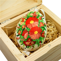 Hand painted duck egg nested inside a hand painted wooden box with a matching floral scene. The duck egg is blown out and comes with a ribbon hanger. Magnetized lid. Hand made so no two eggs or boxes are exactly the same.