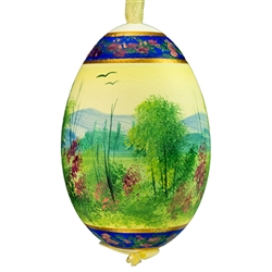 This beautifully designed egg is dyed one color, then white wax is melted and applied to form an intricate design which is left on the surfce. The egg is emptied and strung with ribbon for hanging.