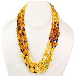 Bozena Przytocka is a designer of artistic amber jewelry based in Gdansk, Poland. Here is a beautiful example of her ability to blend amber, amethyst and peridot  to create a stunning necklace.