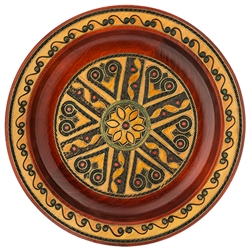 This Polish plate is made from beech wood in the mountain region of southern Poland called Podhale. The plates are cut and shaped on a lathe by hand. The designs are burned into the wood then painted after staining and varnishing. All the designs are