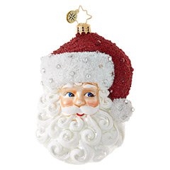 This St. Nick enchants with gleaming silver accents and jewels sprinkled about his cap and curly white beard.