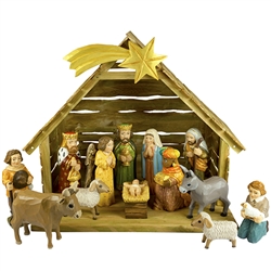 The Holy Family and in particular the Nativity is a popular theme in Polish folk art. Composed of a natural wood creche  and all hand painted wooden pieces. Tallest figure is approx 6.25" tall. This is the work of folk artist Piotr Wolinski and highly