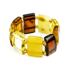 Delightful slices of natural amber connected by a double strand of of woven stretch material and separated with beads. Rings start at size 5 and stretch to fit the largest fingers.  Amber size varies from .3 to .4" high.