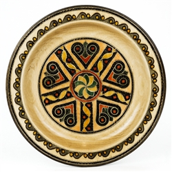 This Polish plate is made from beech wood in the mountain region of southern Poland called Podhale.  The plates are cut and shaped on a lathe by hand.  The floral designs are burned into the wood then painted after staining and varnishing.  All the flower