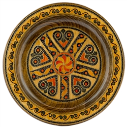 This Polish plate is made from beech wood in the mountain region of southern Poland called Podhale.  The plates are cut and shaped on a lathe by hand.  The floral designs are burned into the wood then painted after staining and varnishing.  All the flower