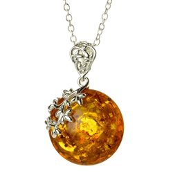 Beautiful sterling silver pendant and adjustable length chain, decorating an oval amber cabochon.  Can be worn on either side.