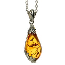 Classic sterling silver pendant and adjustable length chain, framing a beautiful teardrop shaped amber pendant.
