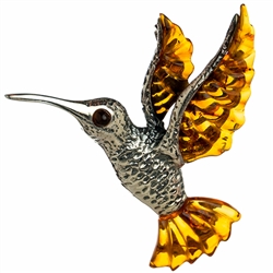 Our beautiful hummingbird is approx 2" x 2".  Silver with amber.  Shades can vary slightly.