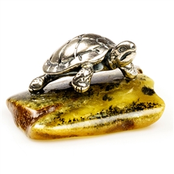 Our small sterling silver turtle has just landed on an natural amber ledge. Hand crafted. Size approx 1" x 1.25" x .6"