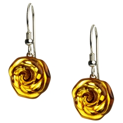 Nicely detailed rose carved into amber with a sterling silver backing.