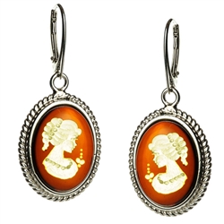 Incredibly beautiful silhouettes carved into Baltic honey amber, set in sterling silver, with hook and lever safety clasp.