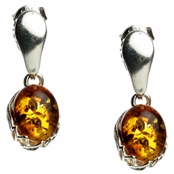 Gorgeous Baltic Amber oval stud earrings surrounded with a ring of Sterling Silver filigree work.