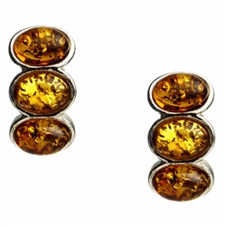 Three oval shaped amber cabochons set in silver with post backs.  Size approx .75" x .4"