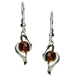 Honey amber wrapped in Sterling Silver teardrops. Stylish and unique.Amber is soft, only slightly harder than talc, and should be treated with care.