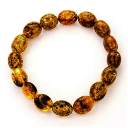 Beautifully shaped oval amber beads speckled with lots of inclusions.
Elastic makes it easy to put on and take off.  Interior diameter is approx 2.5" before stretch.  Bead length is approx .5".