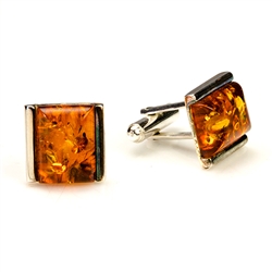 Squares of cognac colored amber set in sterling silver.  Approx .5" square.