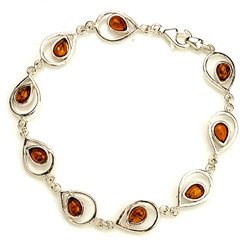 9 tear shaped amber beads each set in a sparkling sterling silver frame. 8" - 20cm long.