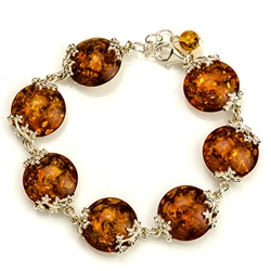 7 spheres of amber each set with sparkling sterling. 7" to 8" adjustable.