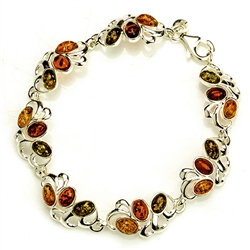 Three shades of amber set in silver in this lovely bracelet 7.5" long.