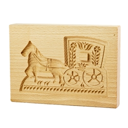 Solid beech wood hand carved mold featuring a traditional horse and carriage folk design. This mold comes from the gingerbread museum in Torun, Poland. These types of wooden molds are used to create gingerbread and cookie designs.