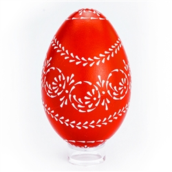 This beautifully designed egg is dyed one color (red) then white wax is melted and applied using a drop pull technique to form a design which is left on the surface. The egg is then emptied through a hole at the top and bottom. Stand sold separately. Hand