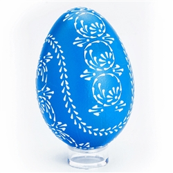 This beautifully designed egg is dyed one color (blue) then white wax is melted and applied using a drop pull technique to form a design which is left on the surface. The egg is then emptied through a hole at the top and bottom. Stand sold separately.