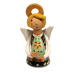 Our beautiful little ceramic angel is dressed in her Polish folk costume and is holding a painted egg (pisanka).  Totally hand made and painted in Poland.  Stamped and artist initialed on the bottom.  No two angels are exactly alike as they are all hand