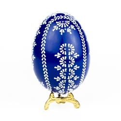 This beautifully designed egg is dyed one color then white wax is melted and applied to form an intricate design which is left on the surface. The egg is emptied. Stand not included.
