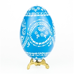 This beautifully designed egg is dyed one color then white wax is melted and applied to form an intricate design which is left on the surface. The egg is emptied. Stand not included.