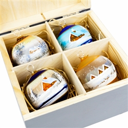 Hand painted glass ornaments featuring Polish country scenes in a deluxe painted wooden box. Hand made so no two ornaments or boxes are exactly the same. Ornaments are approx 2.25" in diameter.