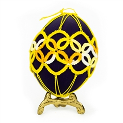 This beautifully designed chicken egg is painted and surrounded in a tatted design. Ready to hang.