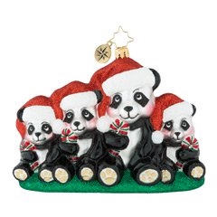 Smartly dressed in their Christmas best, these cuddly pandas hold on to their family photo tradition. Picture perfect!